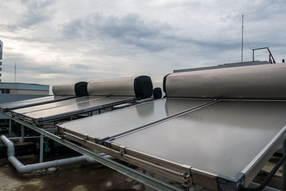 Solar Water Heaters on a Rooftop Under a Cloudy Sky — Taps 'R' Us in Palmwoods, QLD