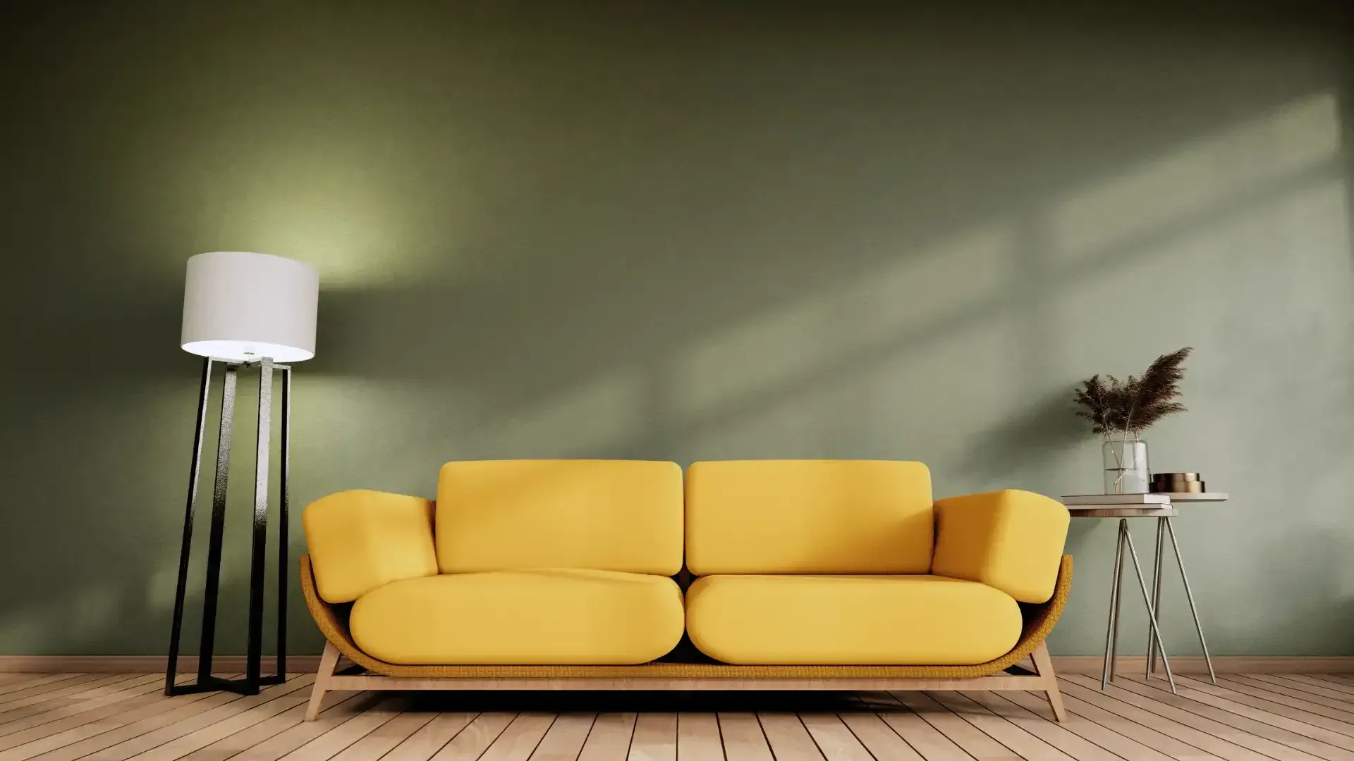 A living room with a yellow couch and a lamp.