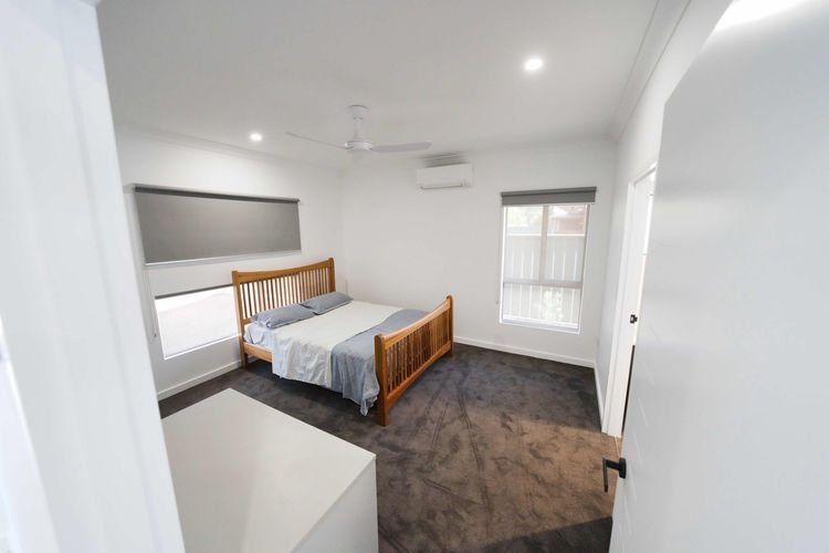 There is a bed in the middle of the room.