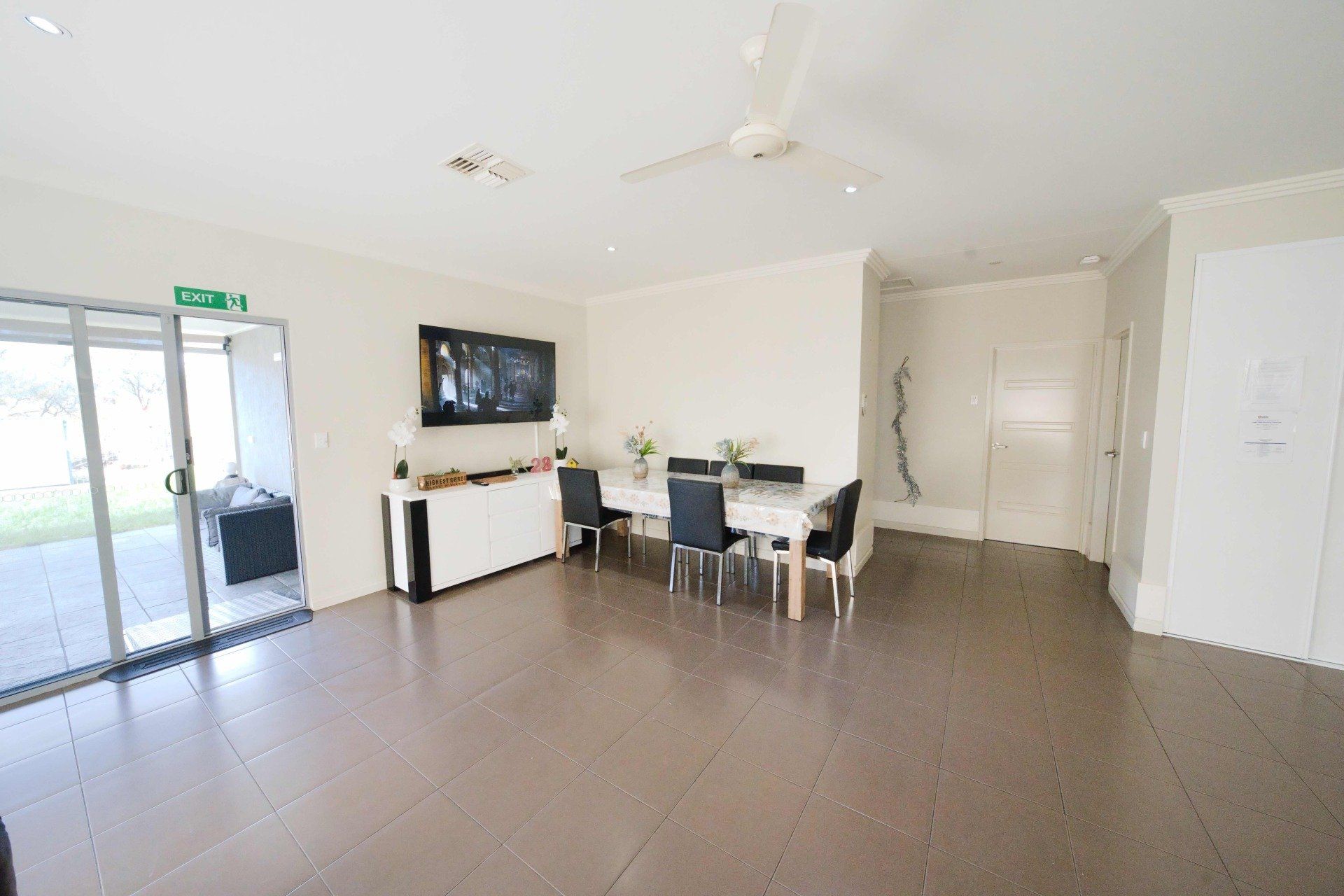 A large room with a dining table and chairs in it.