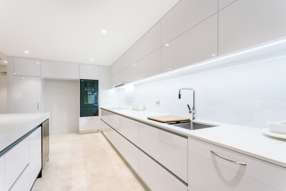 Glossy White Cabinet in Kitchen — Cabinetry In Port Macquarie, NSW