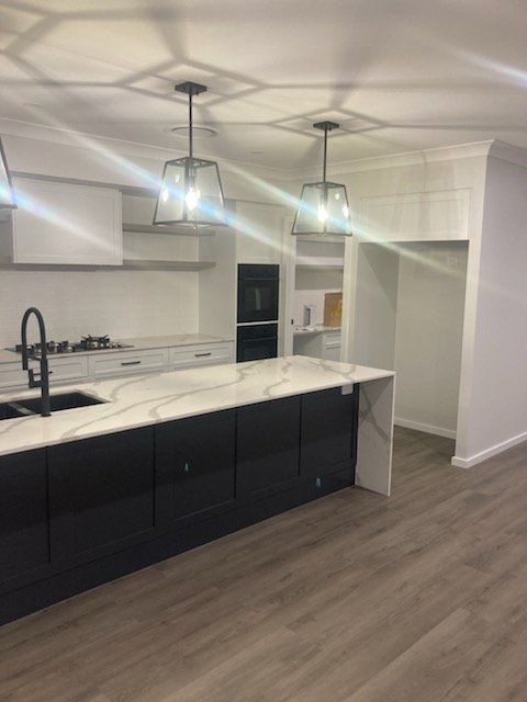 Modern White Kitchen — Cabinetry In Carrington, NSW