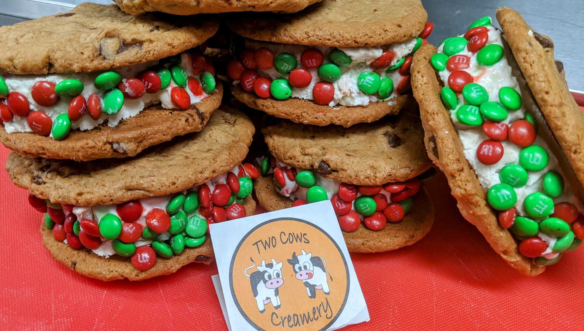 A bunch of cookies stacked on top of each other on a table.