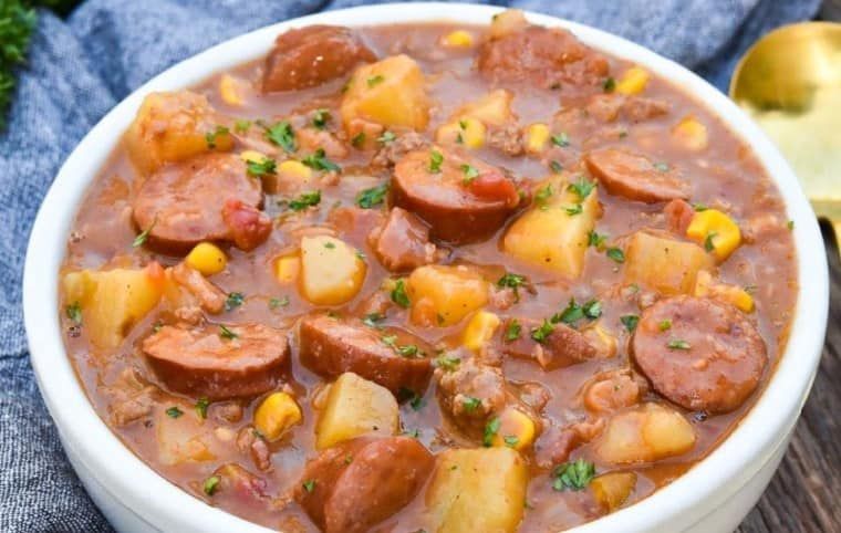 A bowl of sausage and potato soup.