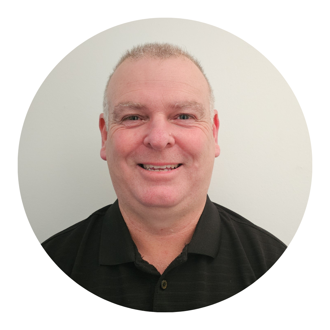 A man in a black shirt is smiling in a circle.