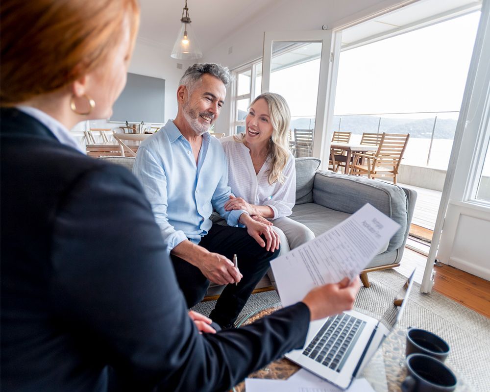 Couple Talking to Finance Advisor — Cartersville, GA — 1st Georgia Home Mortgage