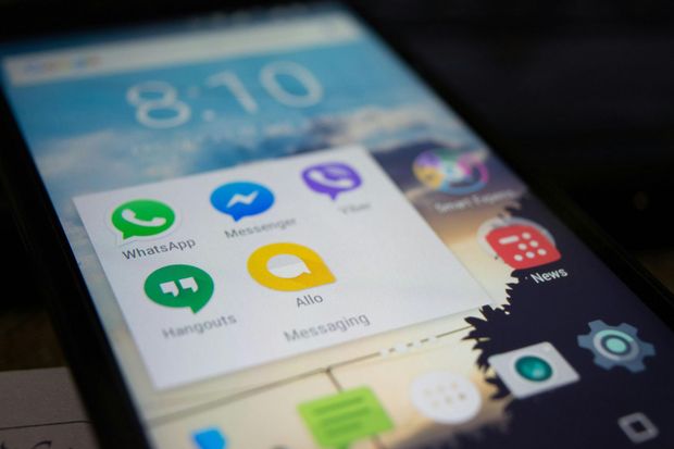 Android home screen with colorful app icons on a phone display, including WhatsApp, Messenger, and Settings