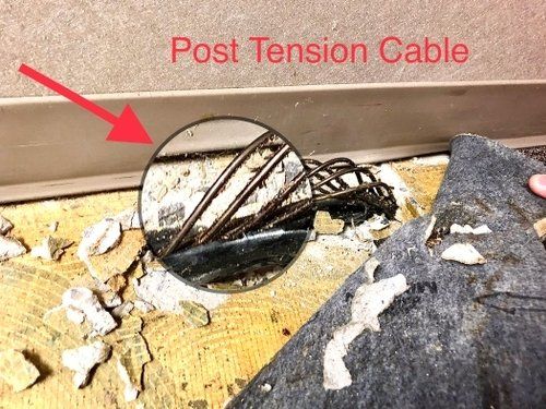 A picture of a post tension cable with a red arrow pointing to it