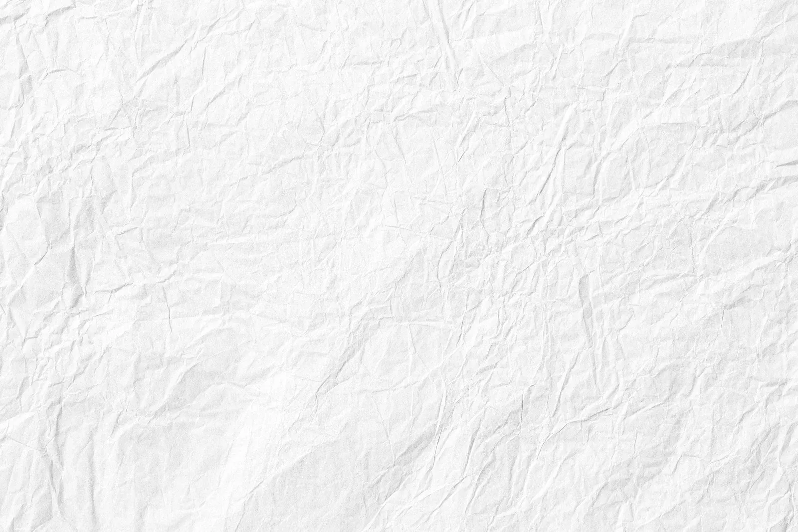 A close up of a piece of white crumpled paper.