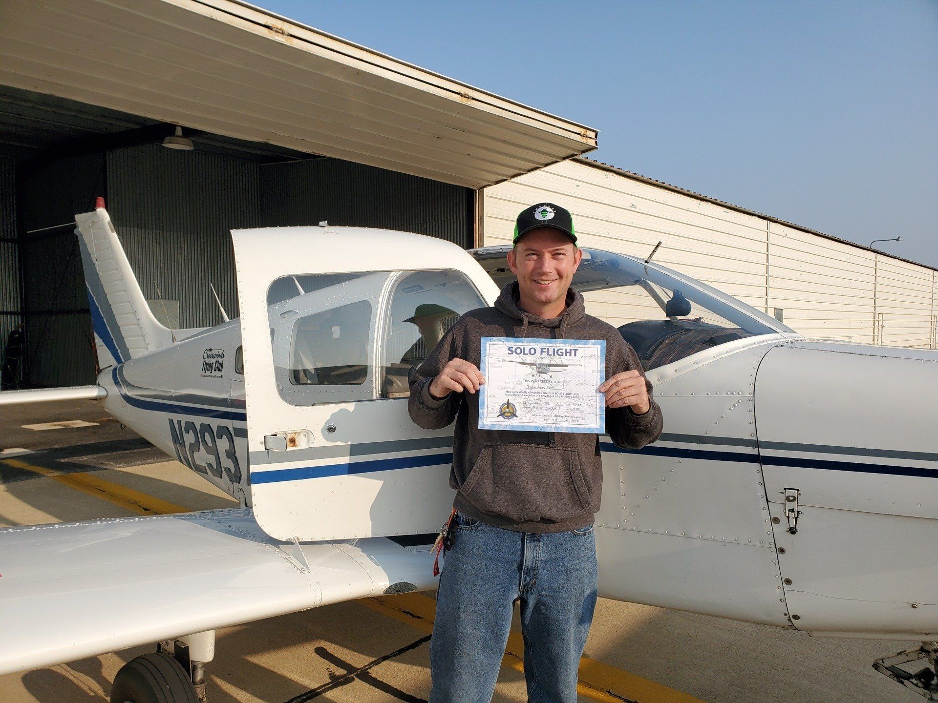 Man Holding Certificate — Bloomington, IL — Tailwind Waymakers