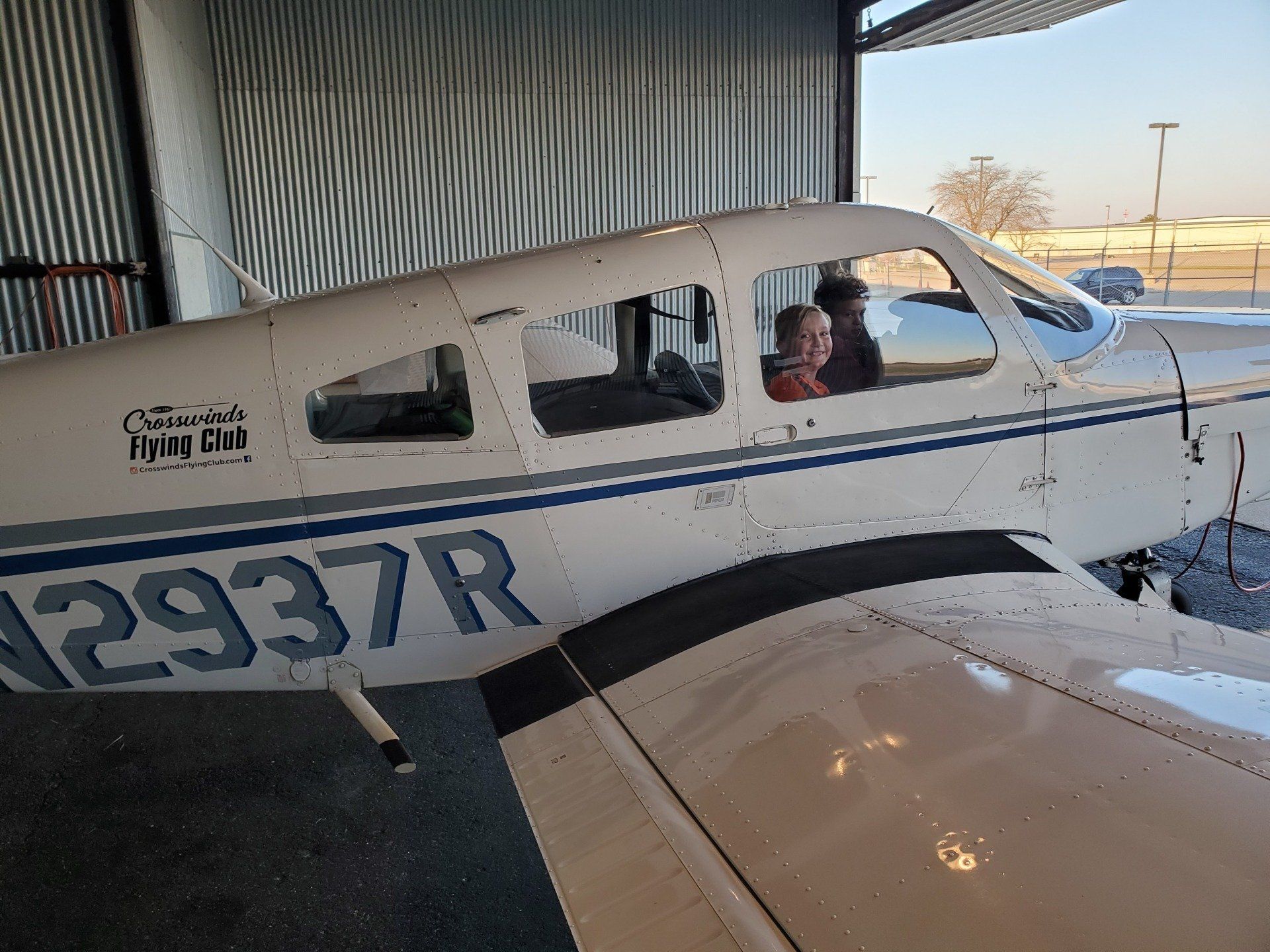 Happy Kids Inside Aircraft — Bloomington, IL — Tailwind Waymakers