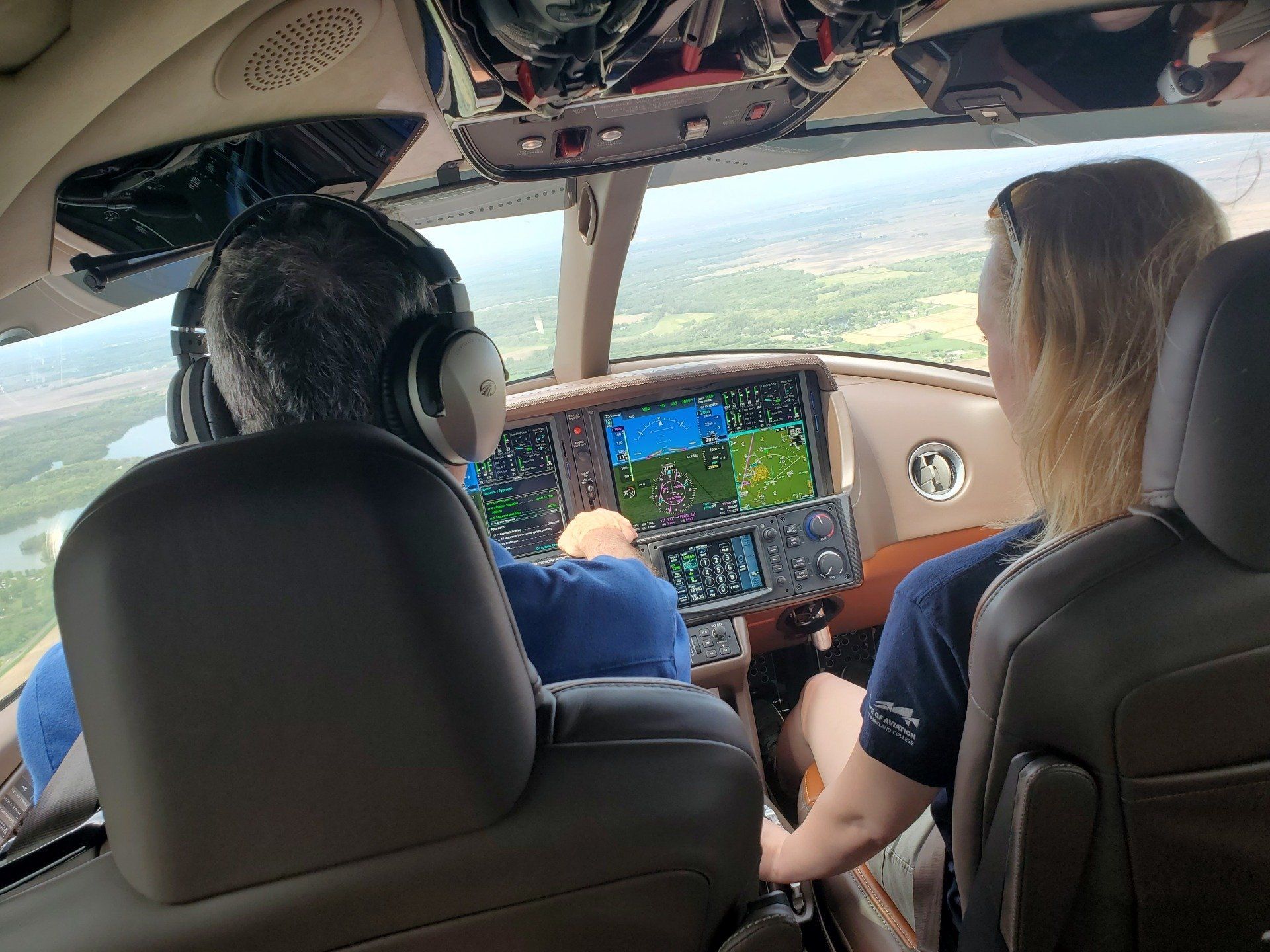 Pilot And Woman Inside The Aircraft — Bloomington, IL — Tailwind Waymakers