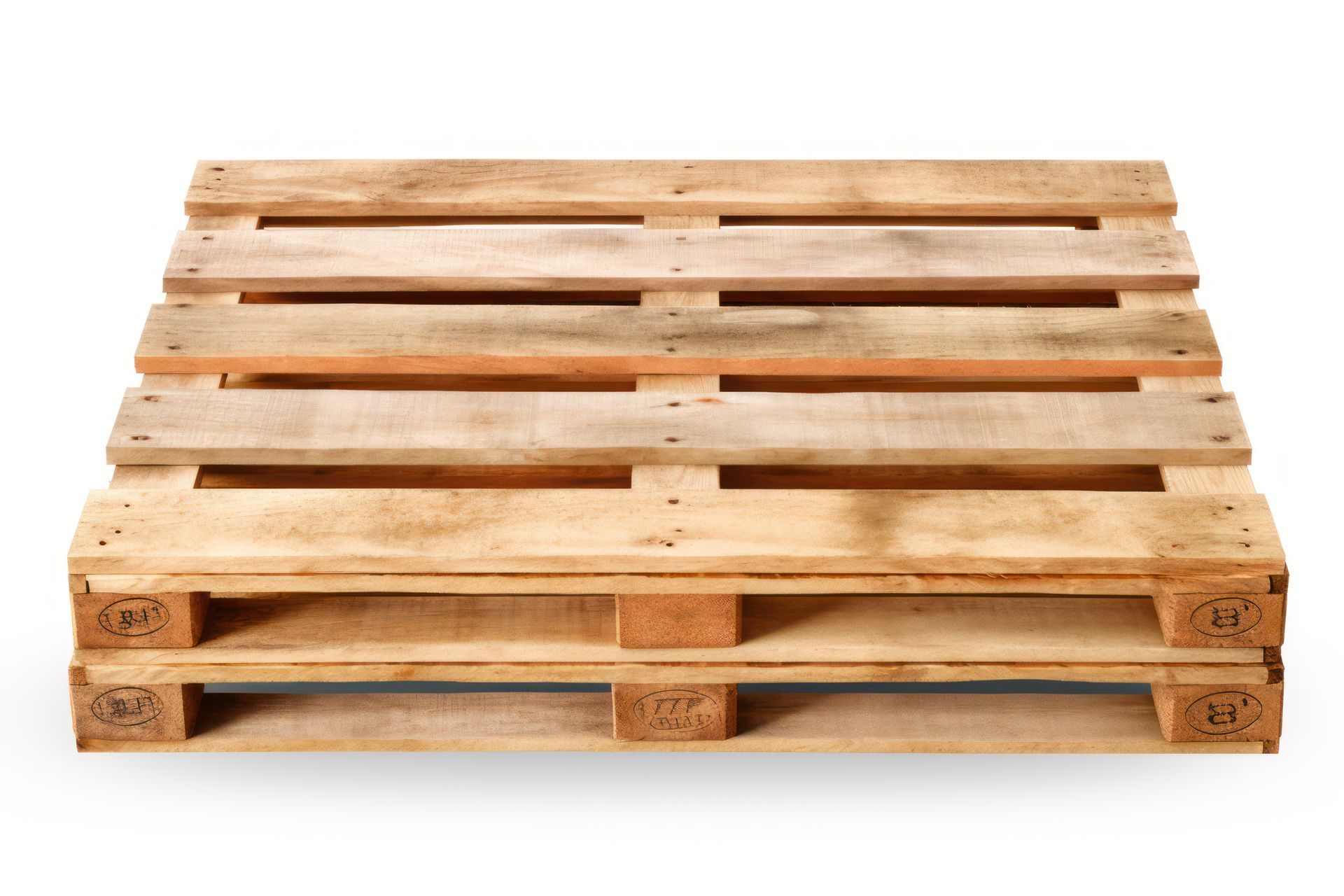 Stacked wooden shipping pallets on a white background