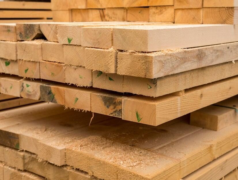 A pile of wooden boards stacked on top of each other.
