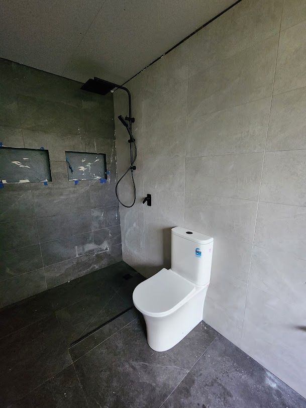 A Bathroom With A Toilet And A Walk In Shower — RAW Plumbing & Gasfitting In Pearce, ACT