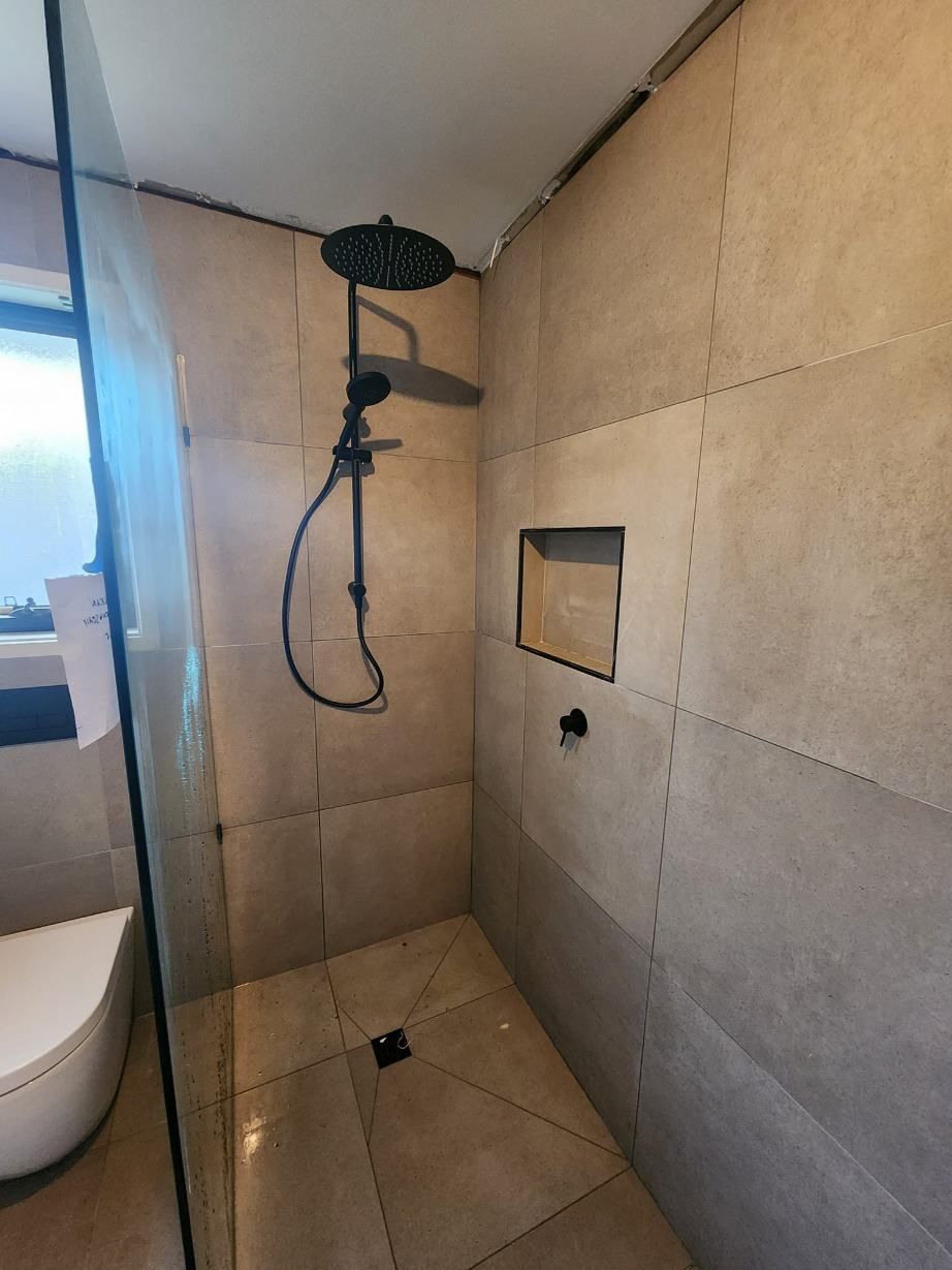 A Bathroom With A Walk In Shower And A Toilet — RAW Plumbing & Gasfitting In Pearce, ACT