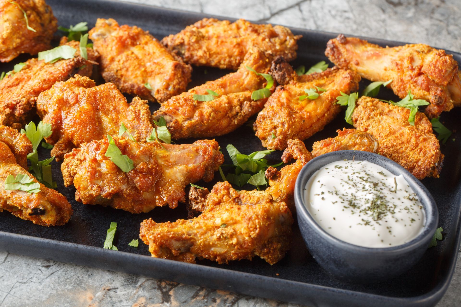 Platter of crispy fried chicken wings.