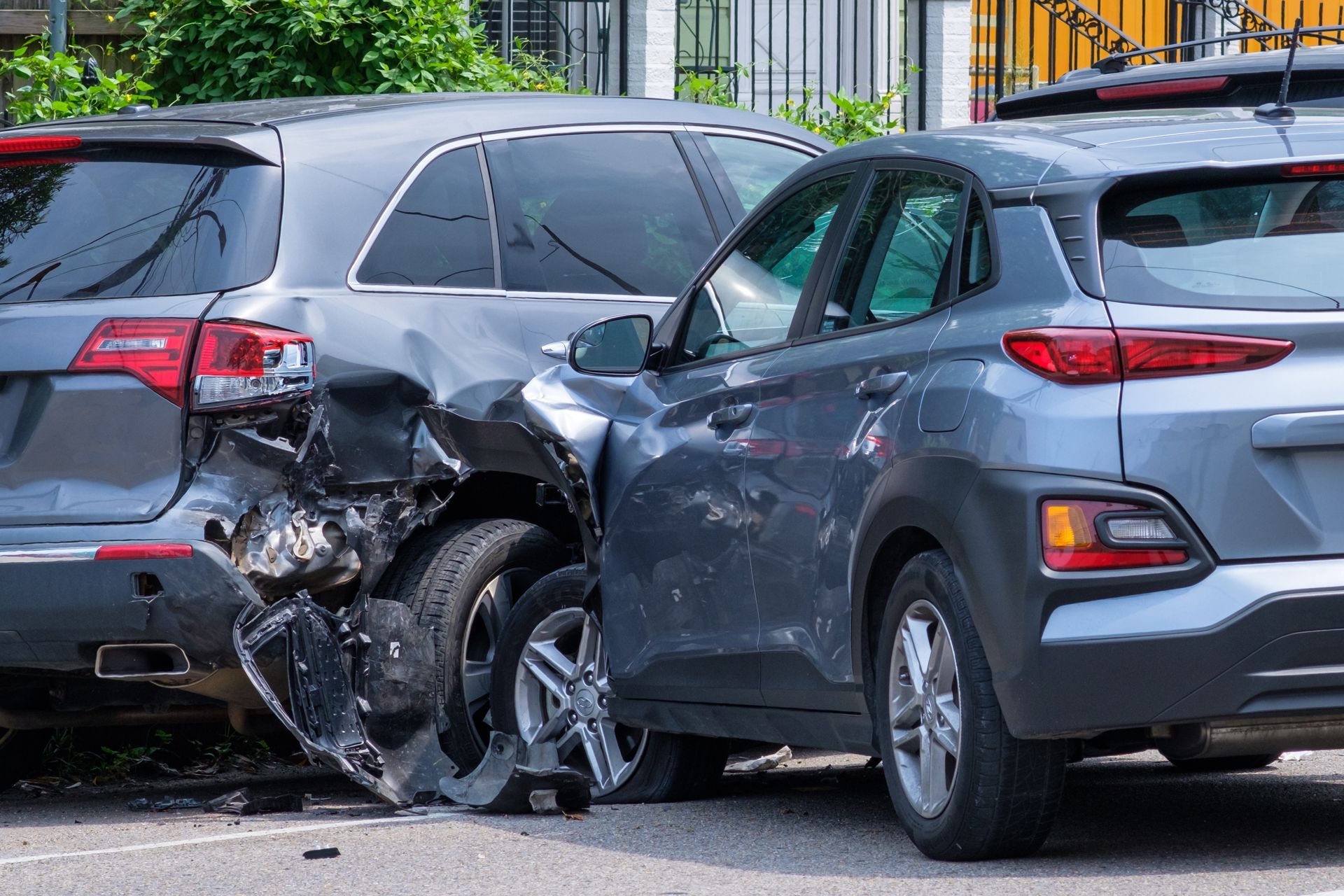 two cars are involved in a car accident on a city street .