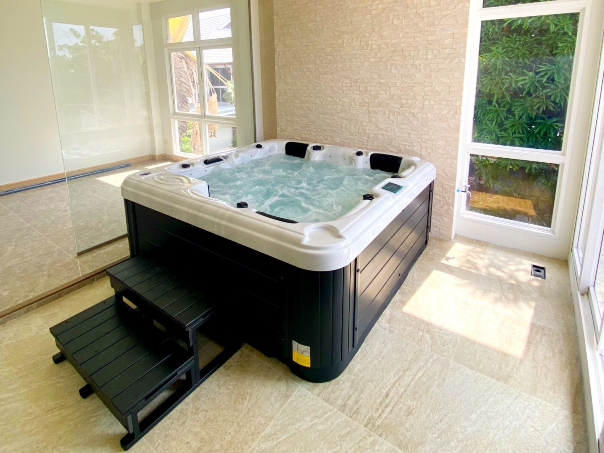 Q&G hot tub built into a bathroom spa corner in Taling Chan District, Bangkok
