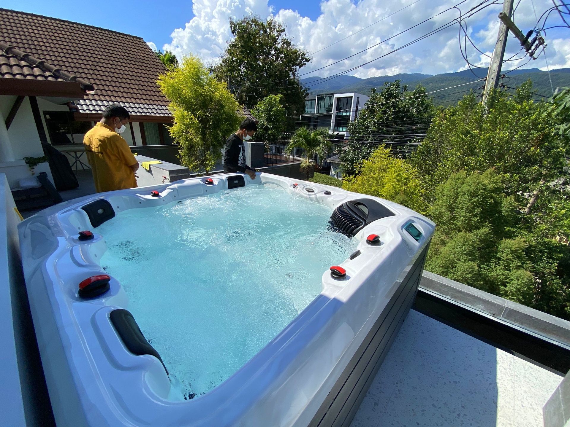Q&G outdoor hot tub on a second-floor balcony in Mueang Chiang Mai, overlooking the surroundings