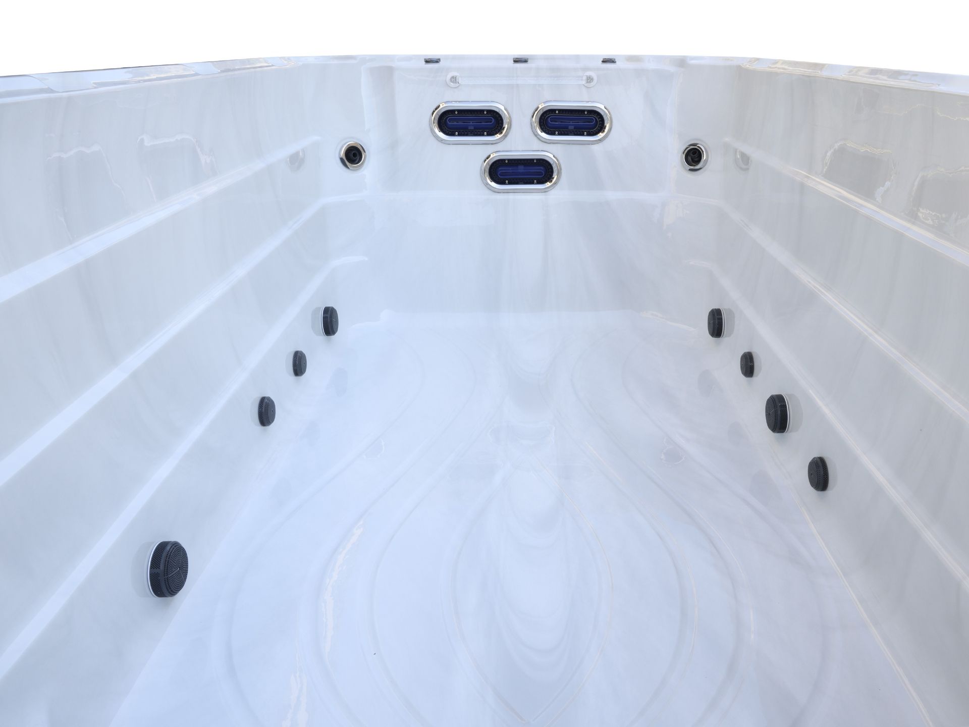 Interior view of a fiberglass swim spa equipped with three counter-current swim jets, designed for stationary swimming, training, and aquatic exercise.