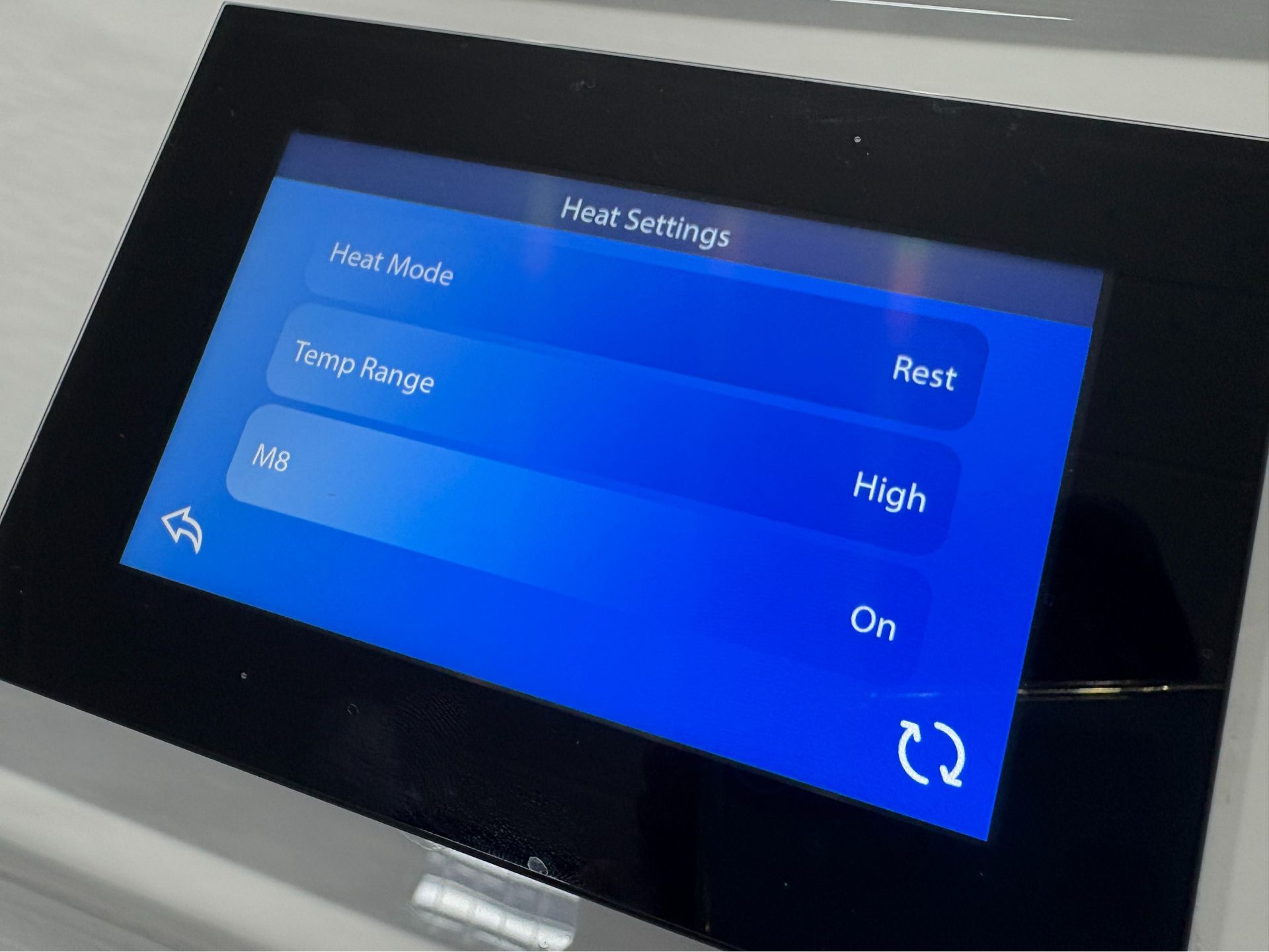 Hot tub heat settings screen showing Rest Mode and temperature range configuration
