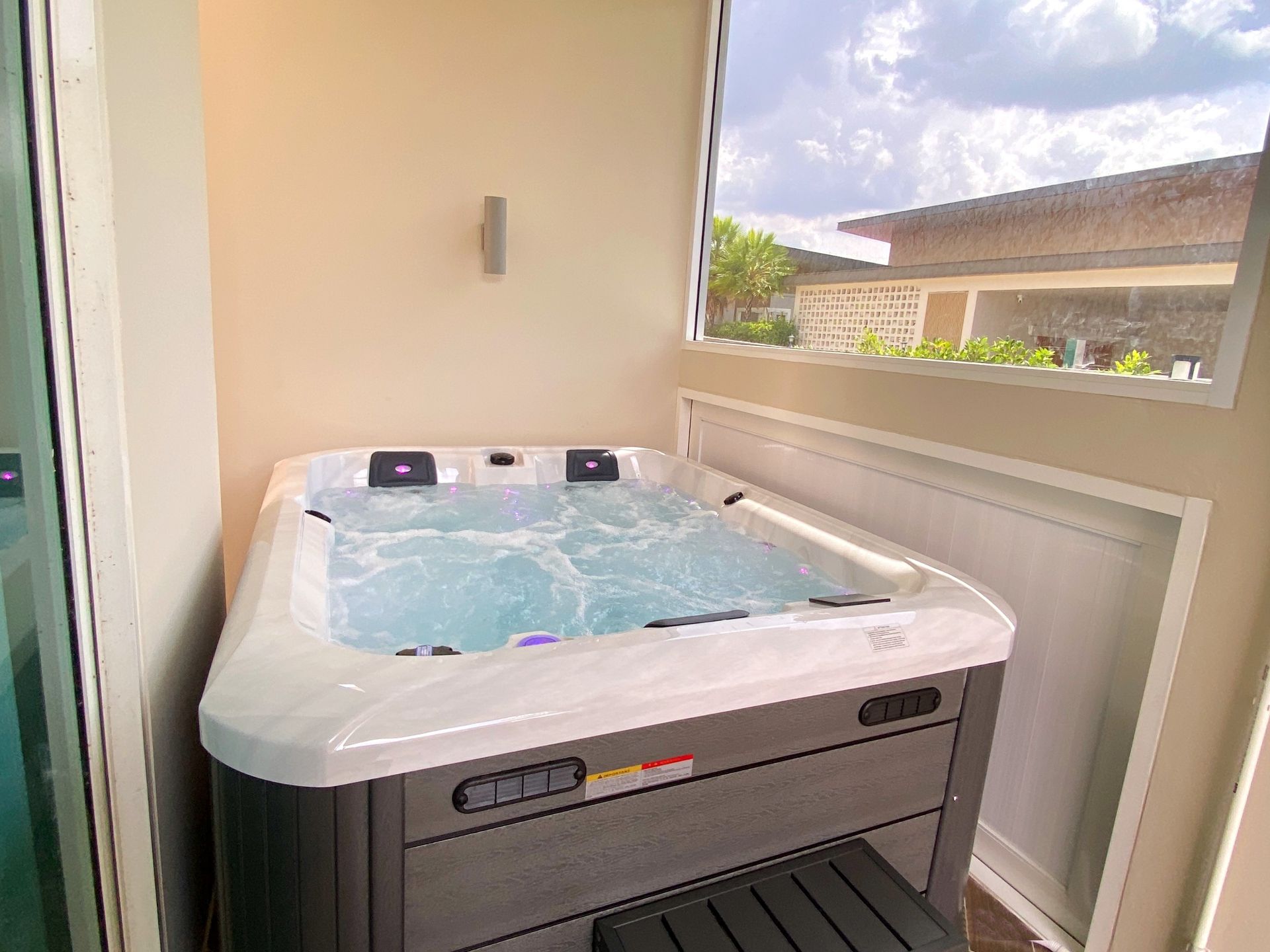 Q&G hot tub installed in a dedicated spa room at the front of a house in Mueang Phitsanulok District