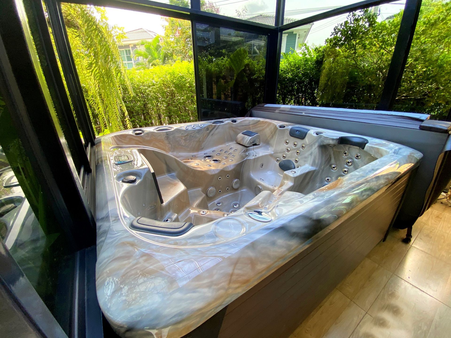 Outdoor hot tub room in a garden in Bangkok, Thailand, with a warm-water spa and hydrotherapy jets