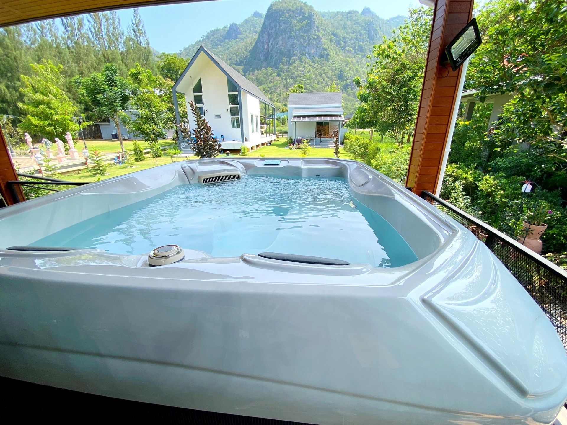 Q&G outdoor hot tub set on a wooden deck at the back of a house in Pakchong, Khao Yai