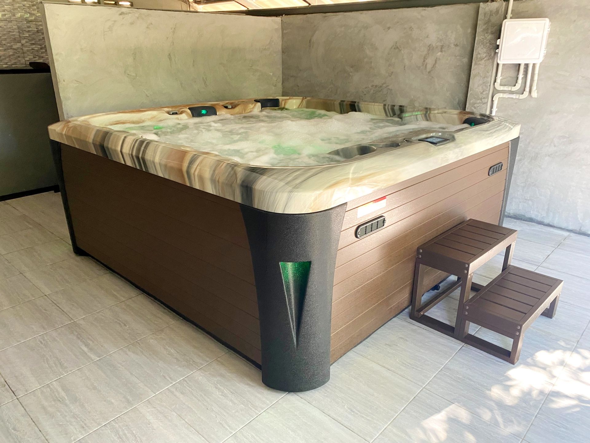 Q&G hot tub built into a large bathroom, creating a private indoor spa in Khao Phanom District, Krabi
