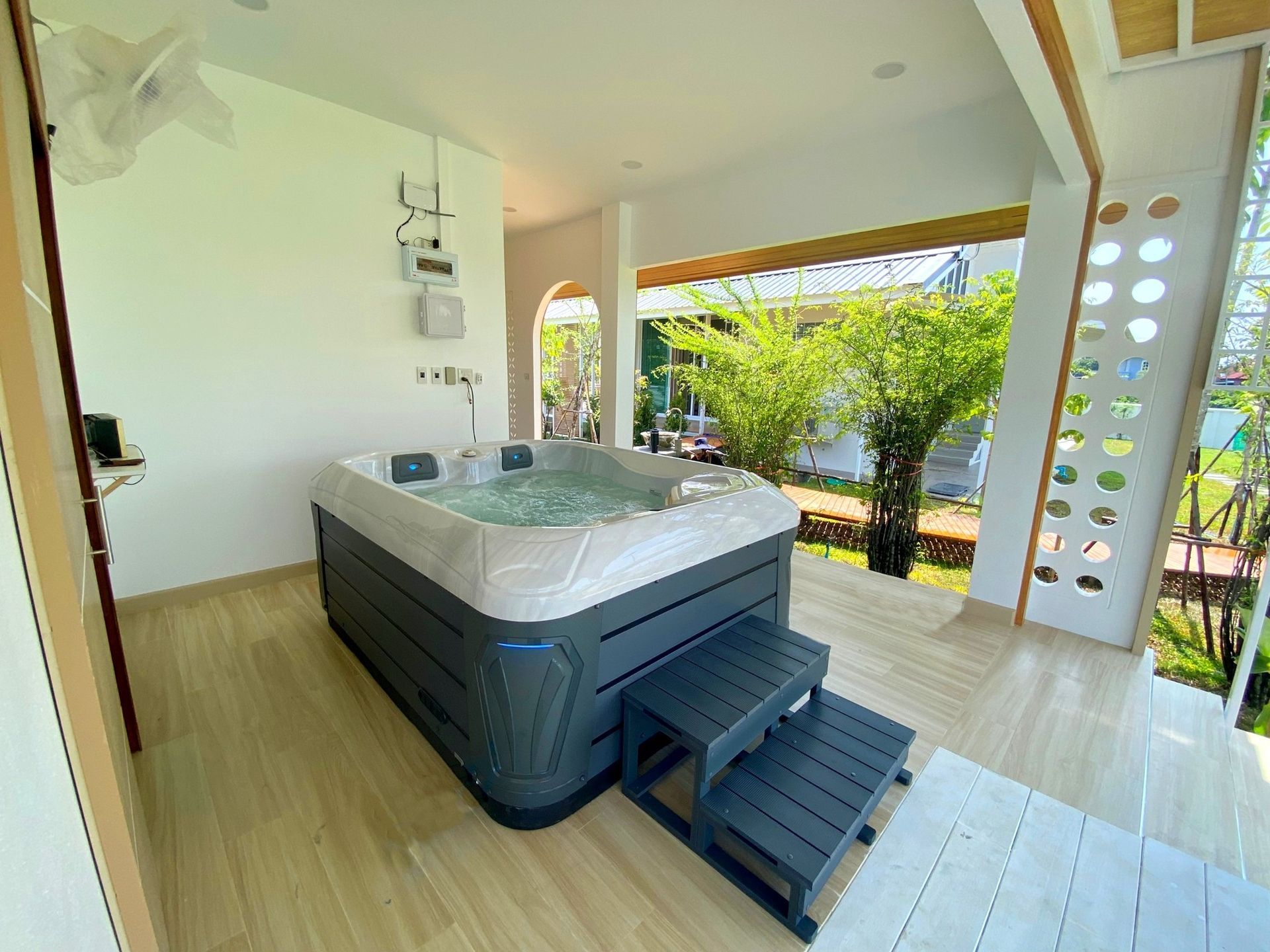 Q&G outdoor hot tub on a terrace with views of the surrounding garden in Si Samrong District, Sukhothai