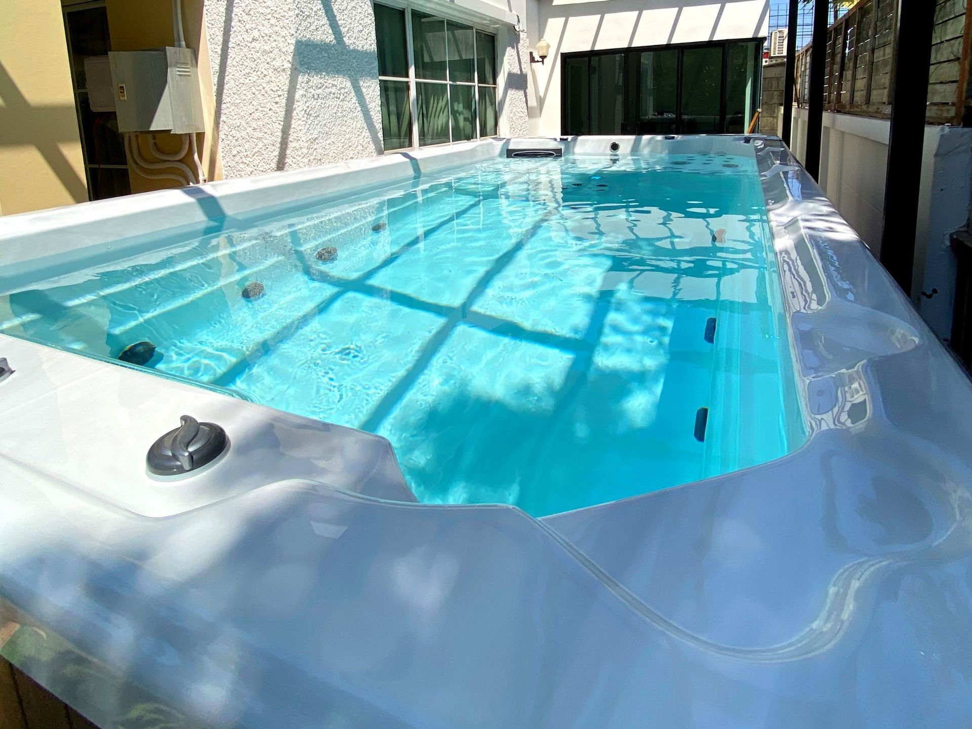 Clear water inside a swim spa equipped with an ozonator water treatment system, helping to reduce bacteria and maintain clean, fresh, and safe water with less chemical use.