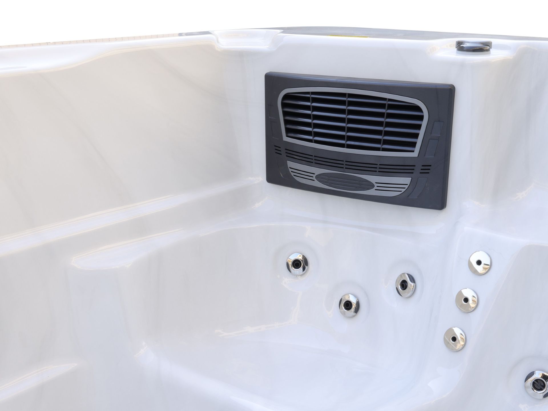 Built-in skimmer wall inside a swim spa, designed to continuously remove surface debris and circulate water through the filtration system for clean and clear water.
