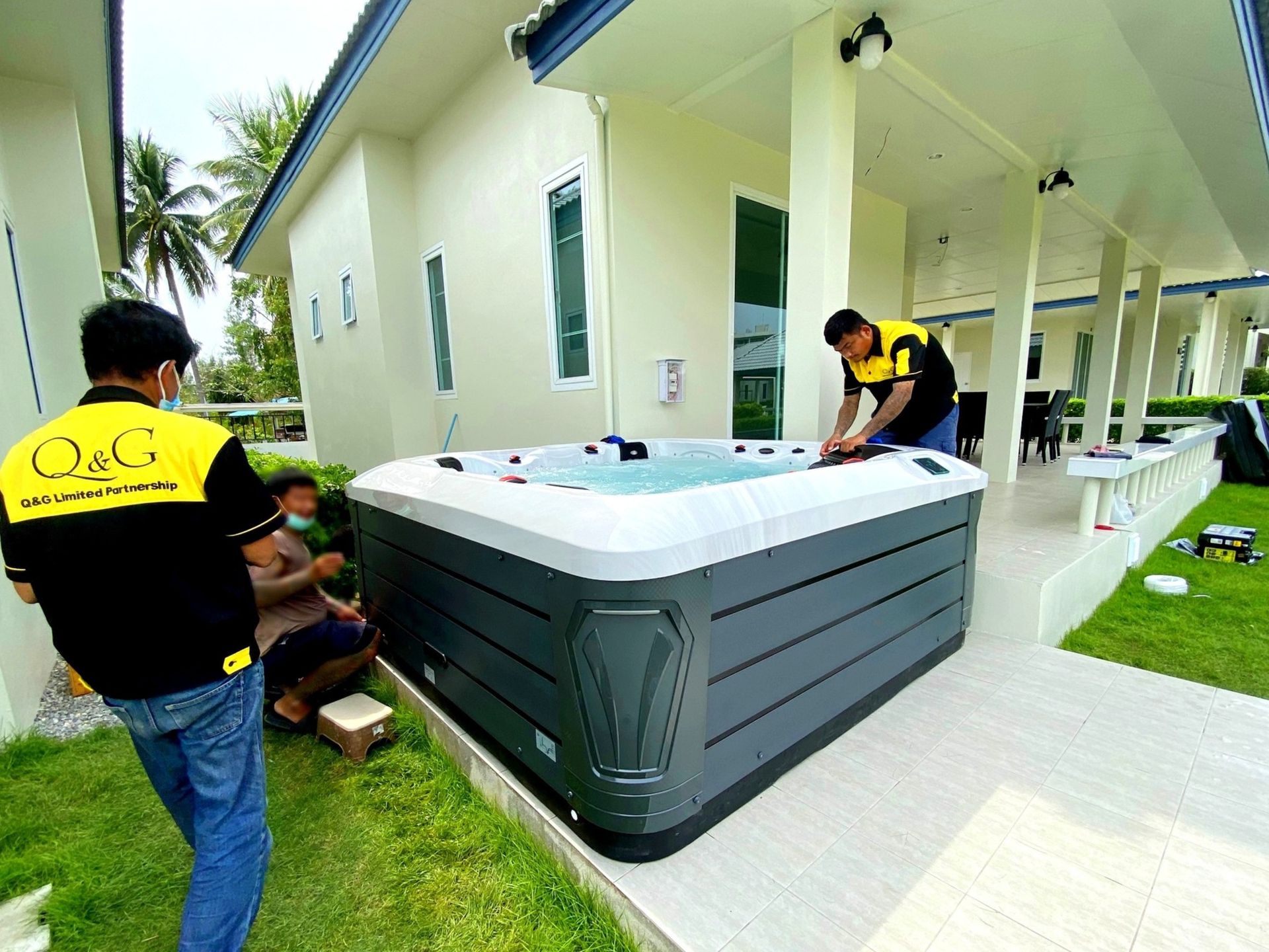 Q&G outdoor hot tub installed in the front yard of a house in Thap Sakae, Prachuap Khiri Khan