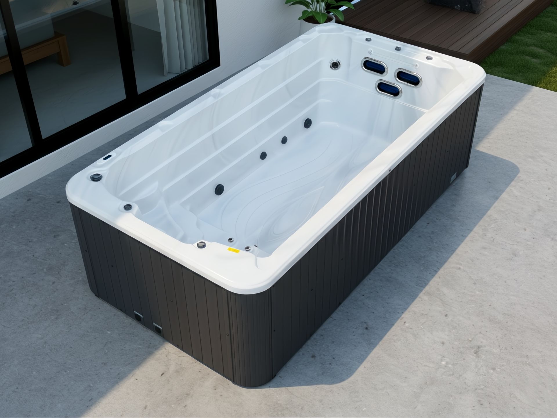 Above-ground swim spa installed in a modern home outdoor area, featuring a compact rectangular design, white acrylic interior, and multiple water jets, ideal for private residential use.