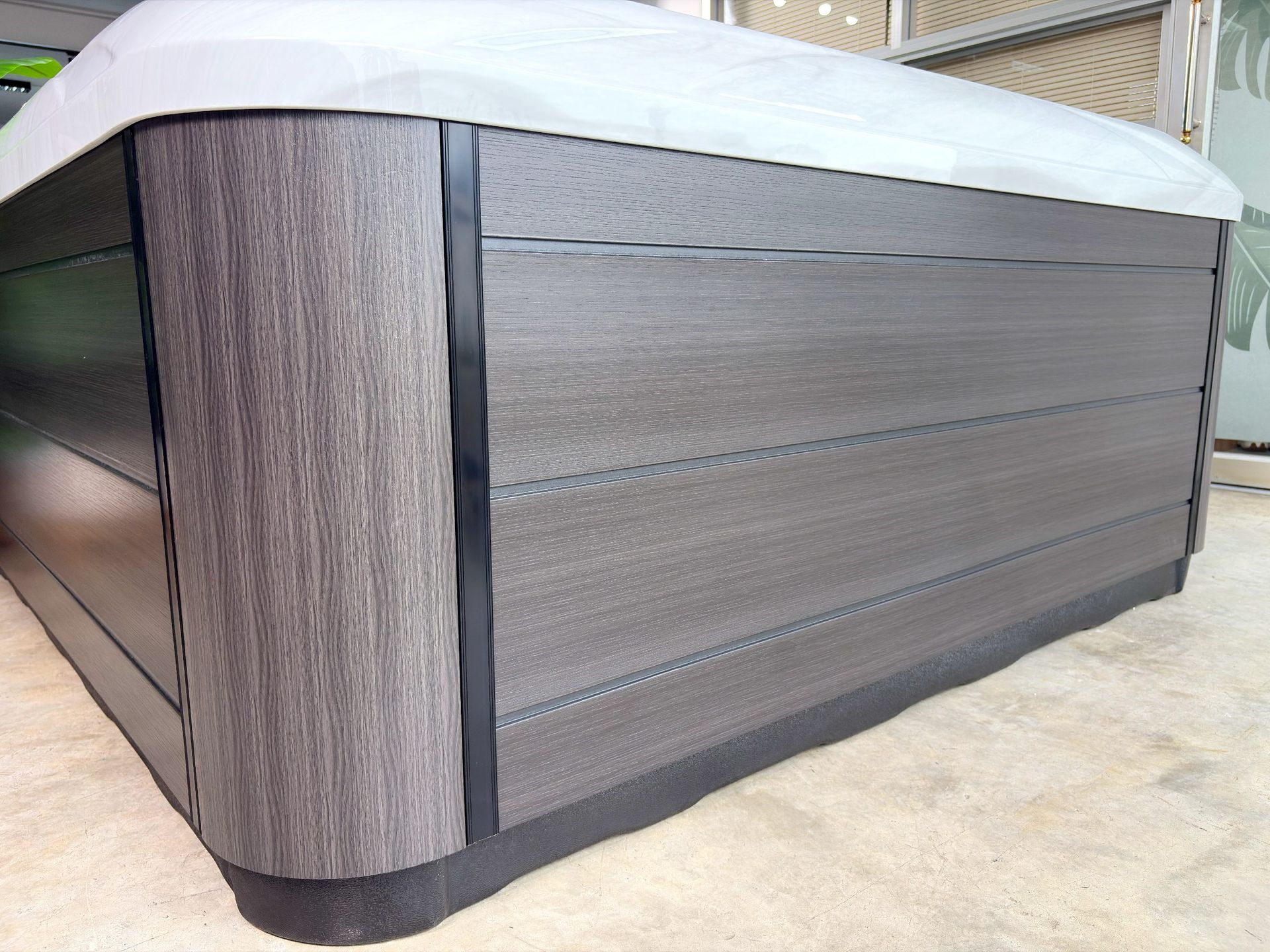 Outdoor hot tub cabinet made of synthetic wood panels showing weather resistance, durability, and low maintenance for long-term value