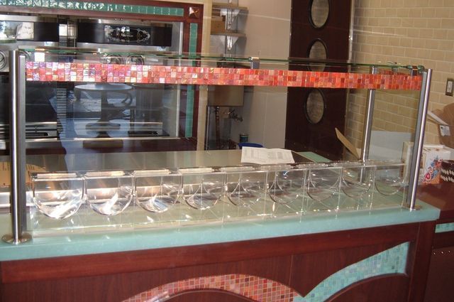 A glass display case with a red ribbon on it