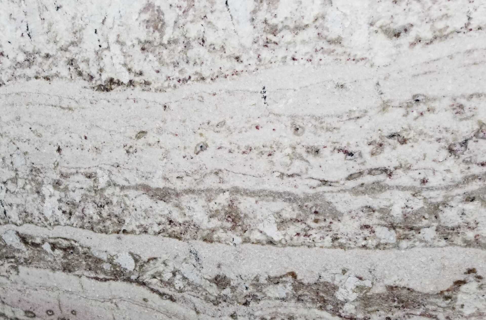 a close up picture of a White Galaxy Leathered slab
