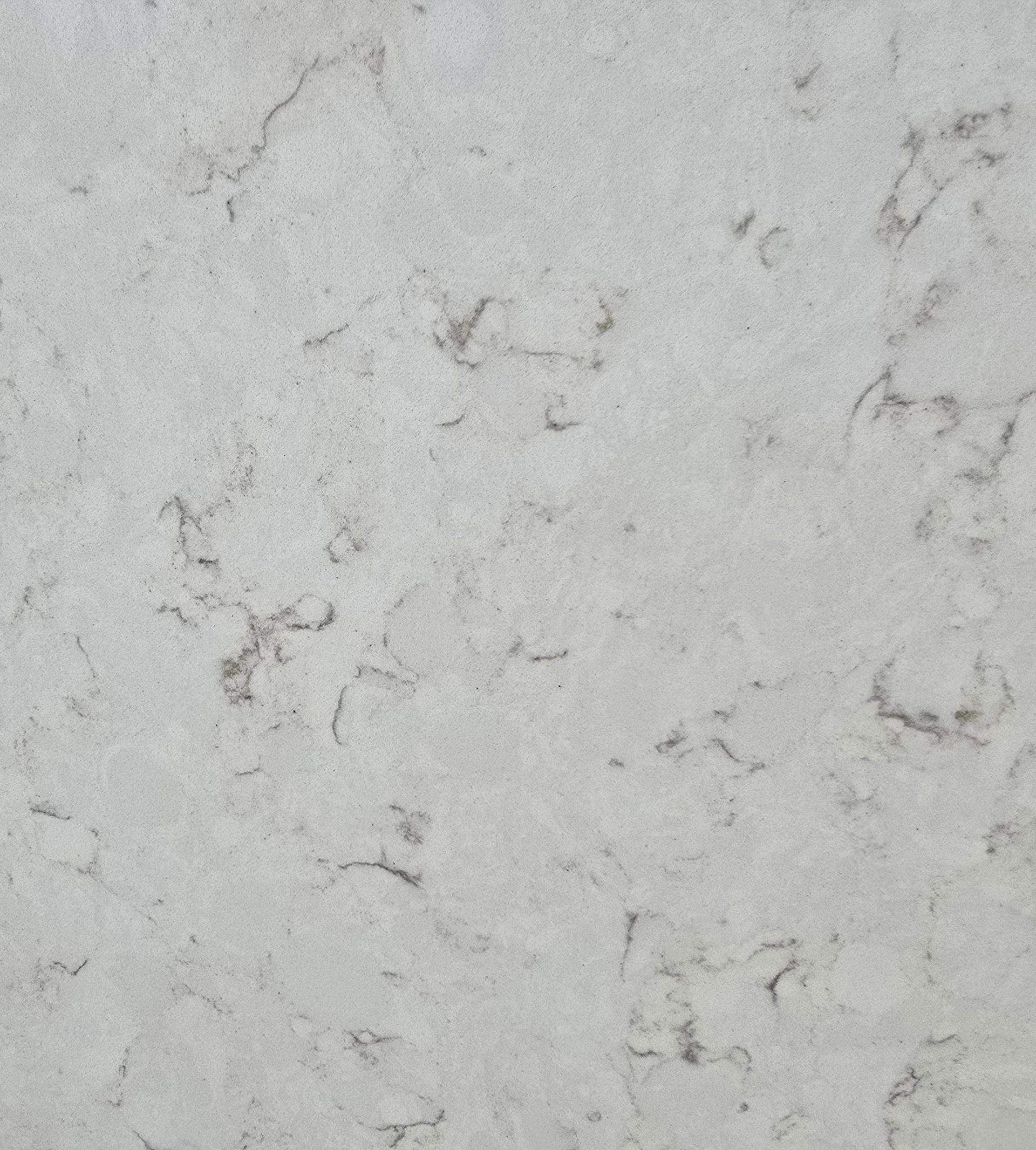 A close up of a white marble counter top.