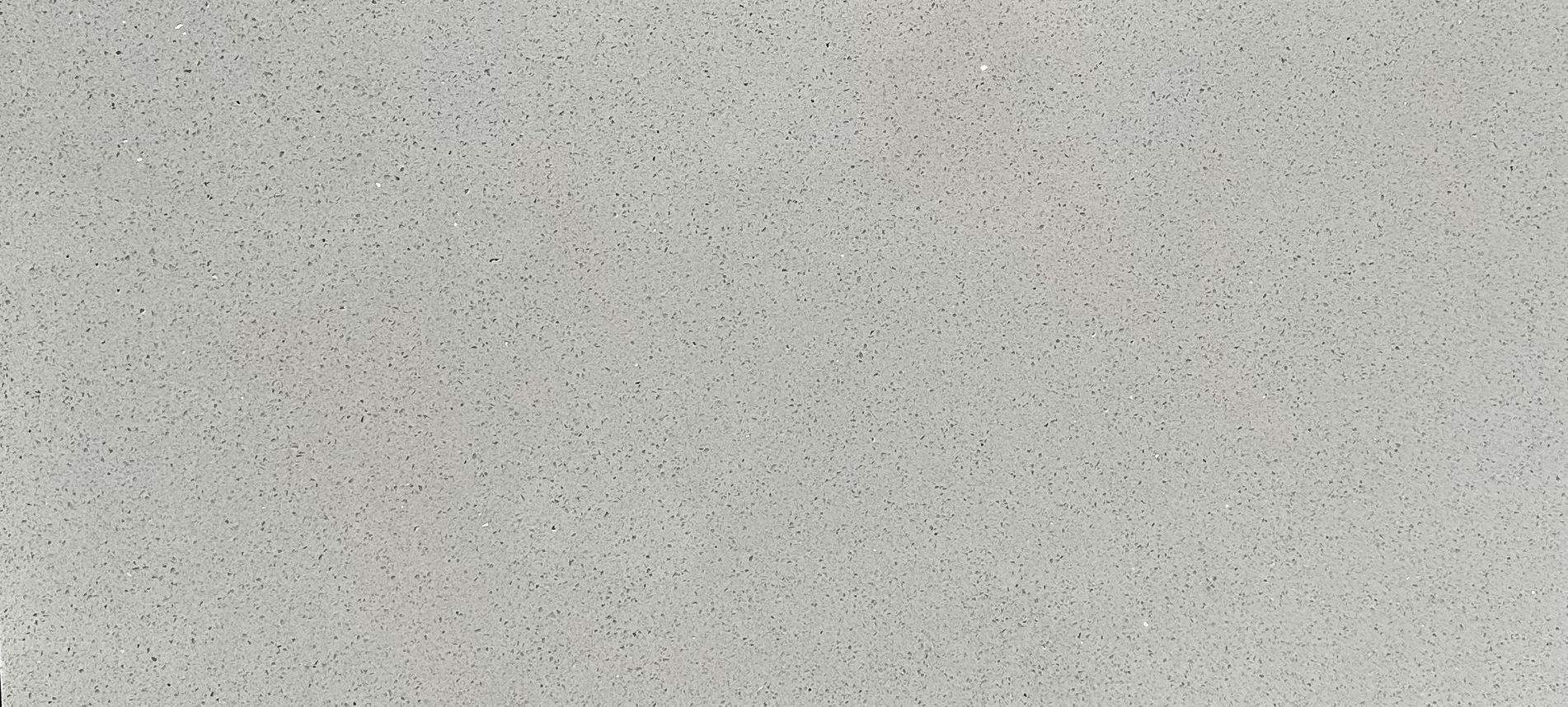 A close up of a white granite counter top.