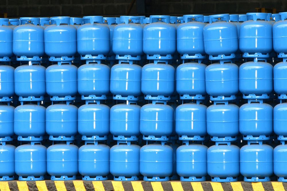 Rows of Blue Industrial Barrels Stacked on a Pallet — Kuranda Gas & Supplies In Cape Tribulation, QLD