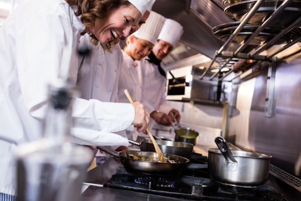 Chefs in White Uniforms Cook in A Restaurant Kitchen — Kuranda Gas & Supplies In Koah, QLD