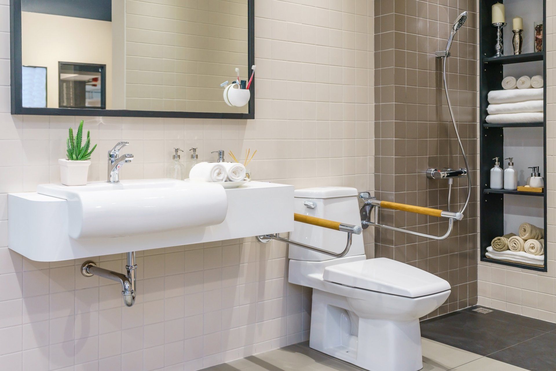 A bathroom with a toilet , sink and mirror.