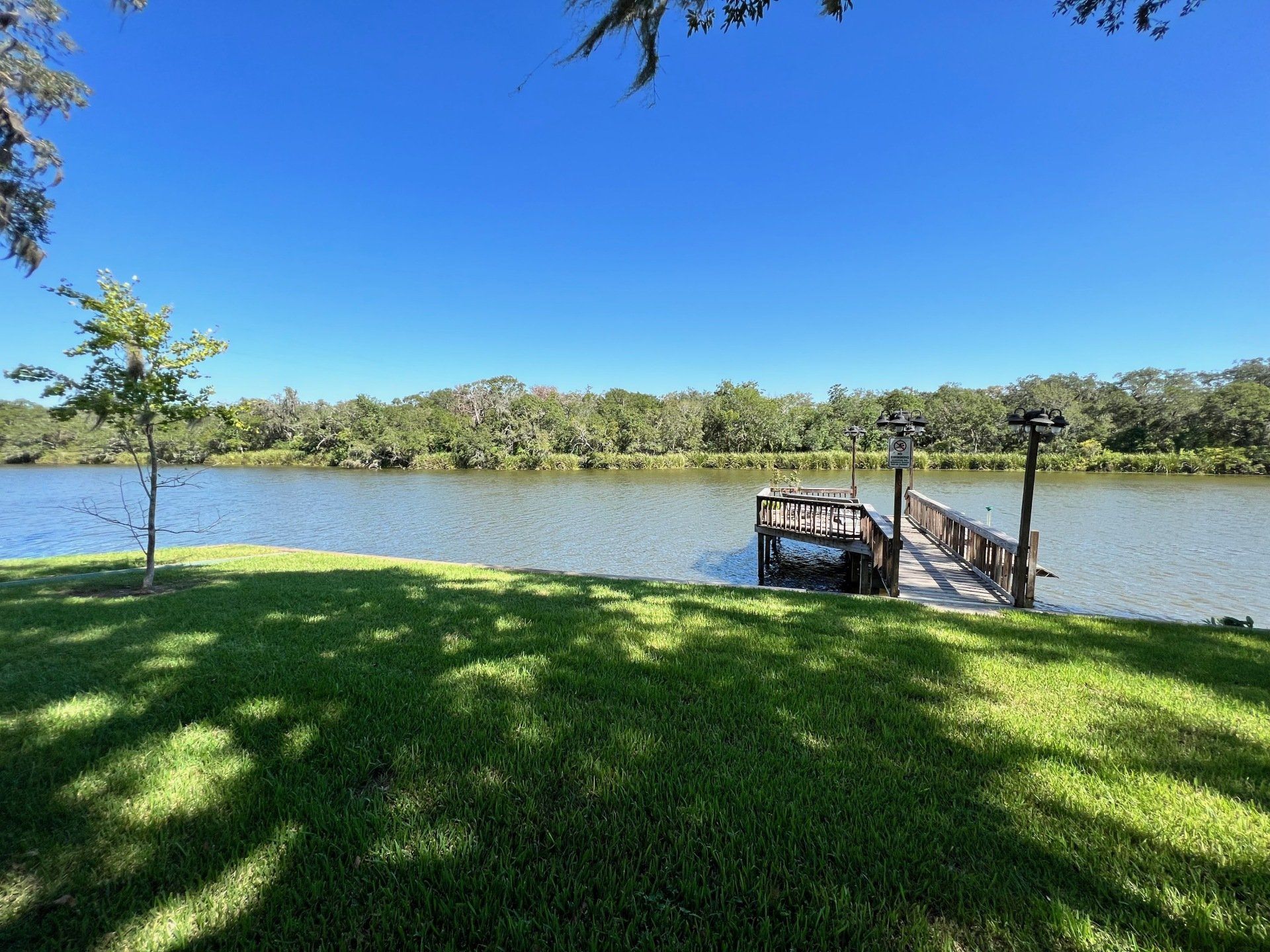 there is a dock in the middle of a lake .