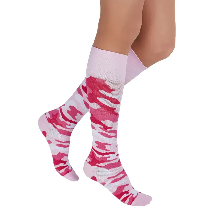 a pair of pink and white camouflage knee high socks
