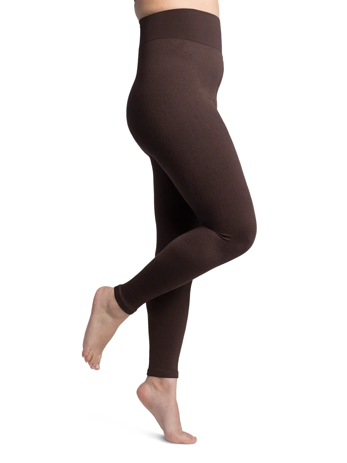a woman is wearing a pair of brown leggings .
