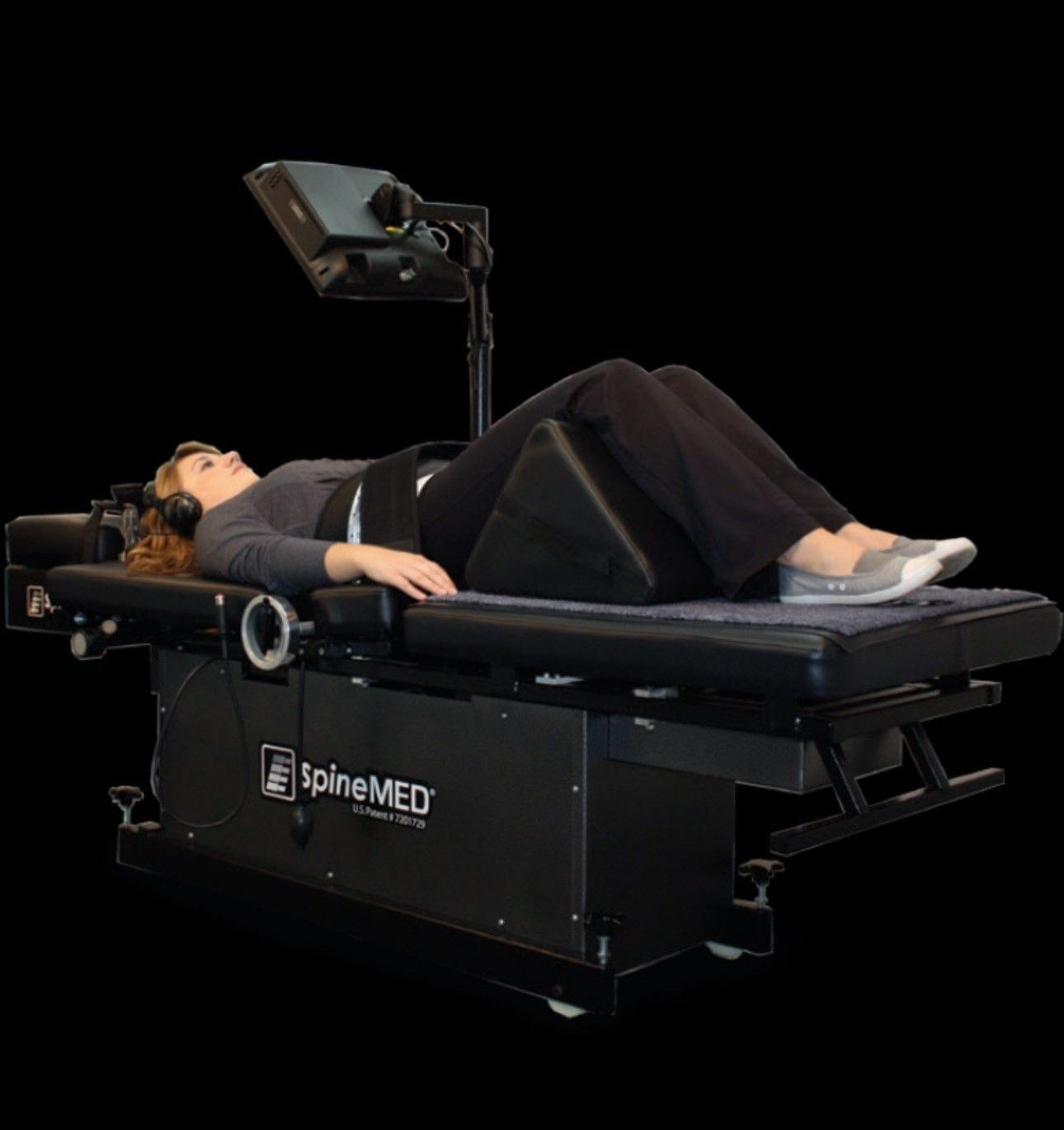 Lady lying on decompression therapy table