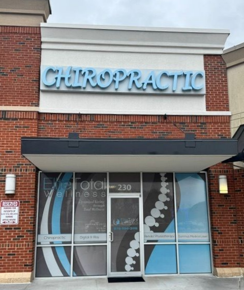 Chiropractor Fixing The Back Of Woman — Acworth, GA — Elite Total Wellness