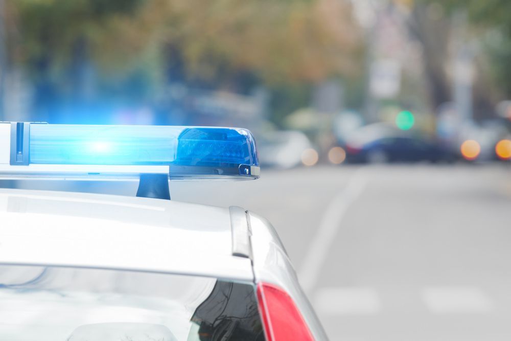 Security patrol car with lights activated during monitoring — Alarm Monitoring in Bowral, NSW