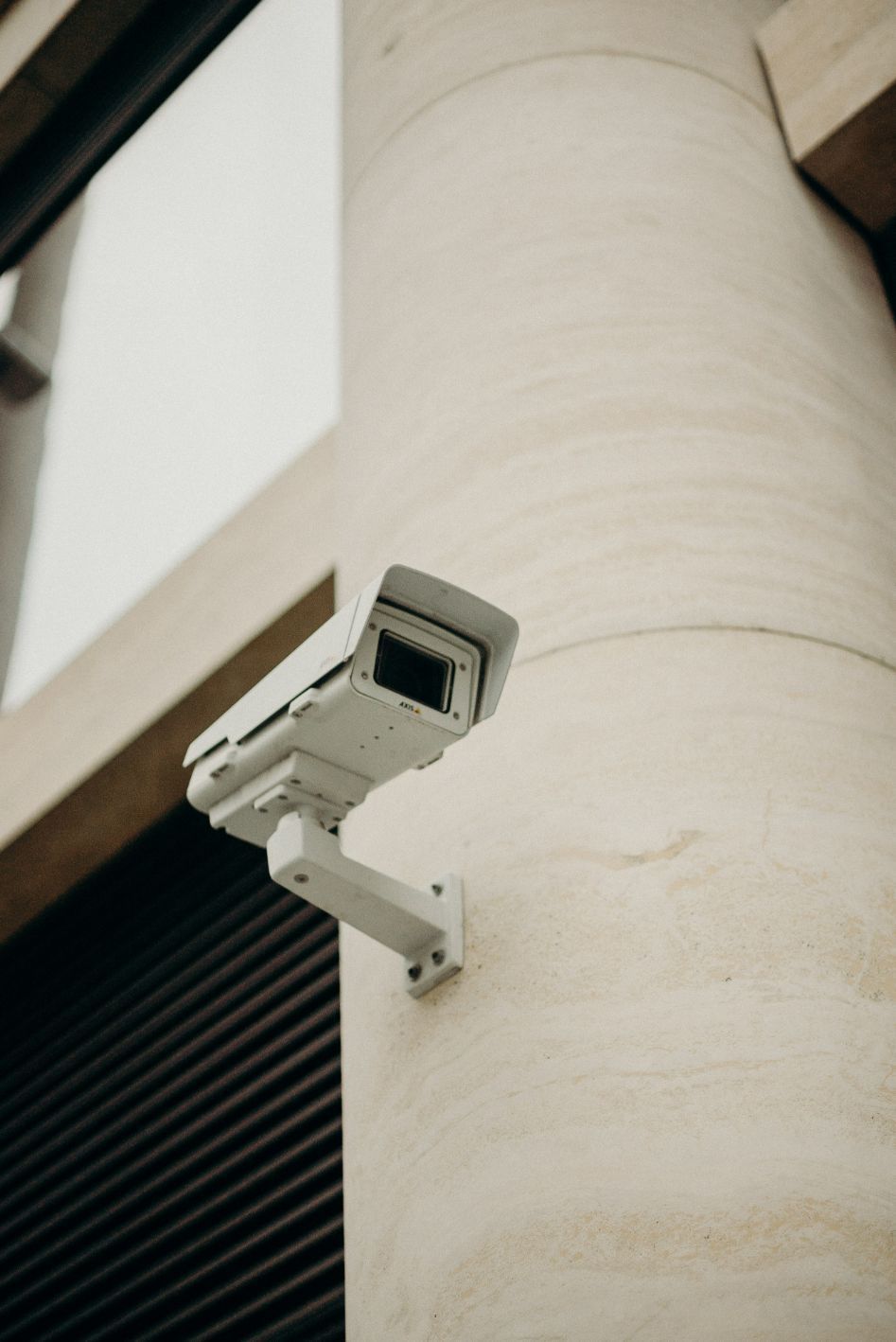White outdoor security camera providing professional surveillance and protection — Security Systems in Southern Highlands, NSW